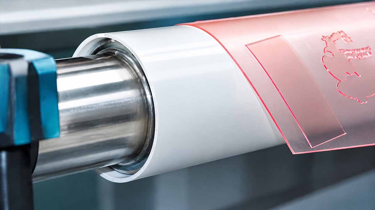 Hard chrome lower roller and aluminium alloy guide wheel close-up — LayerQuestar flexo printer