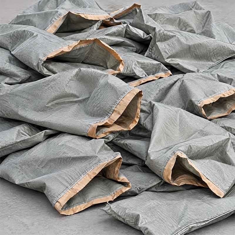 Used cement PP woven bags — inorganic dust contamination requires hot washing before pelletizing